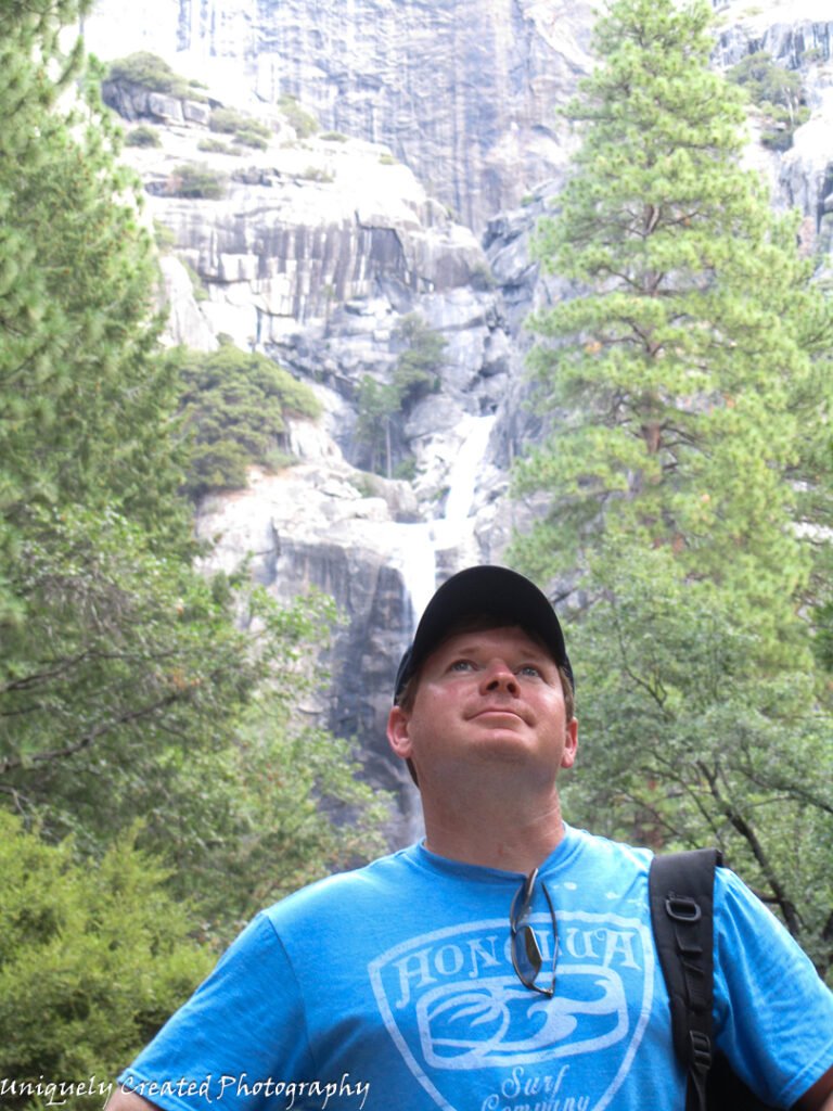 man in the outdoors looking up