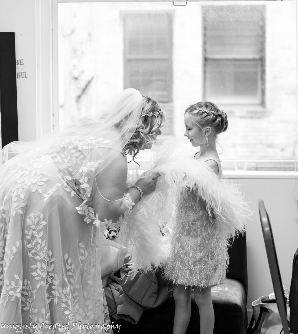 bride talking to Flower girl